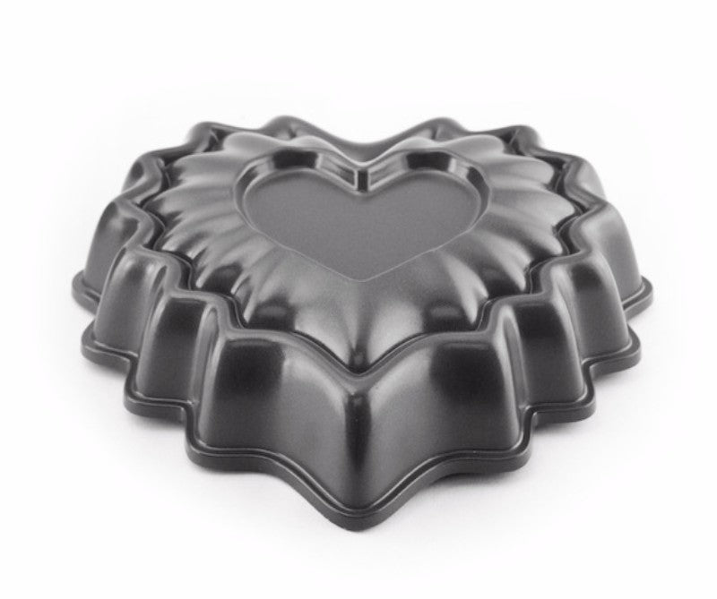Non-stick mini heart bundt pan with 3-cup capacity, perfect for cakes and desserts for special occasions.