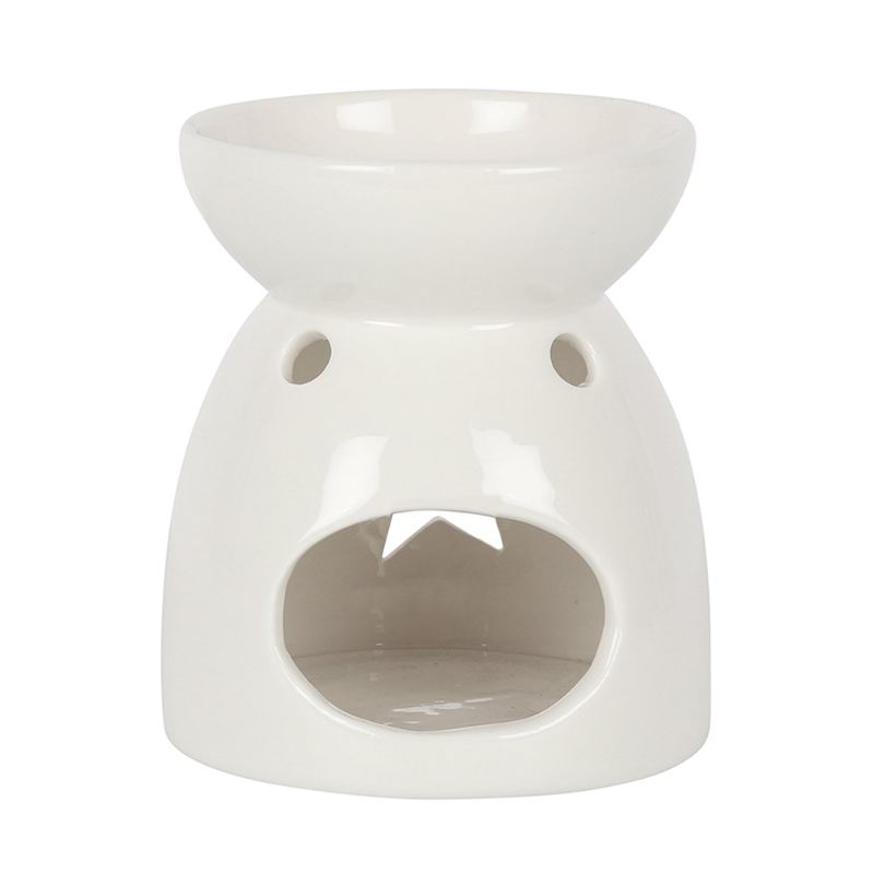 Elegant white ceramic oil burner with star cut-out, perfect for fragrance oils and wax melts, creating a cozy ambiance.