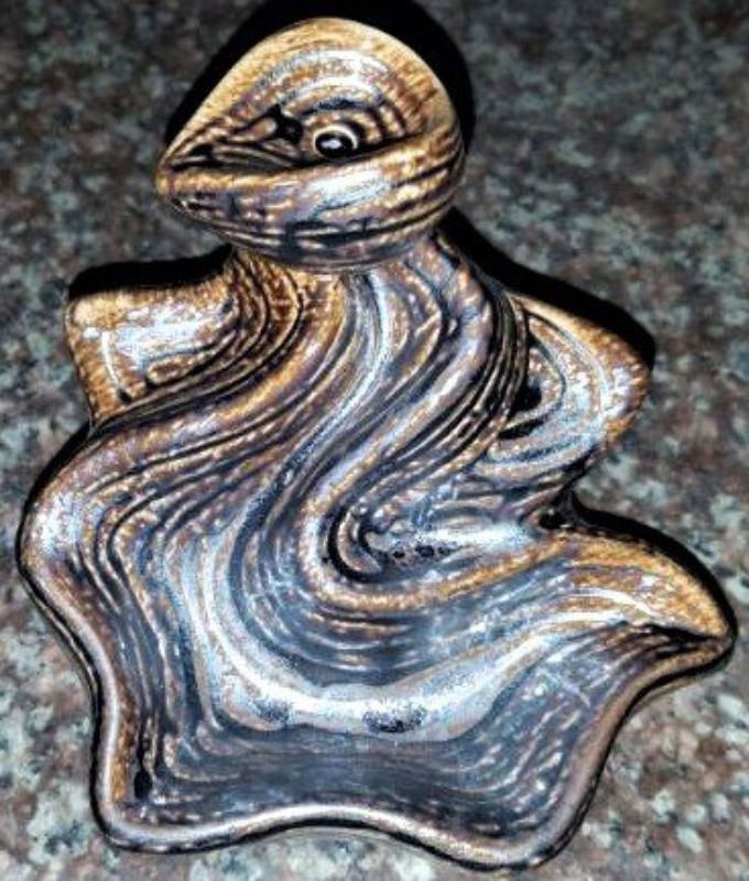 Elegant backflow incense burner creating a captivating smoke waterfall effect for relaxation and aromatherapy.