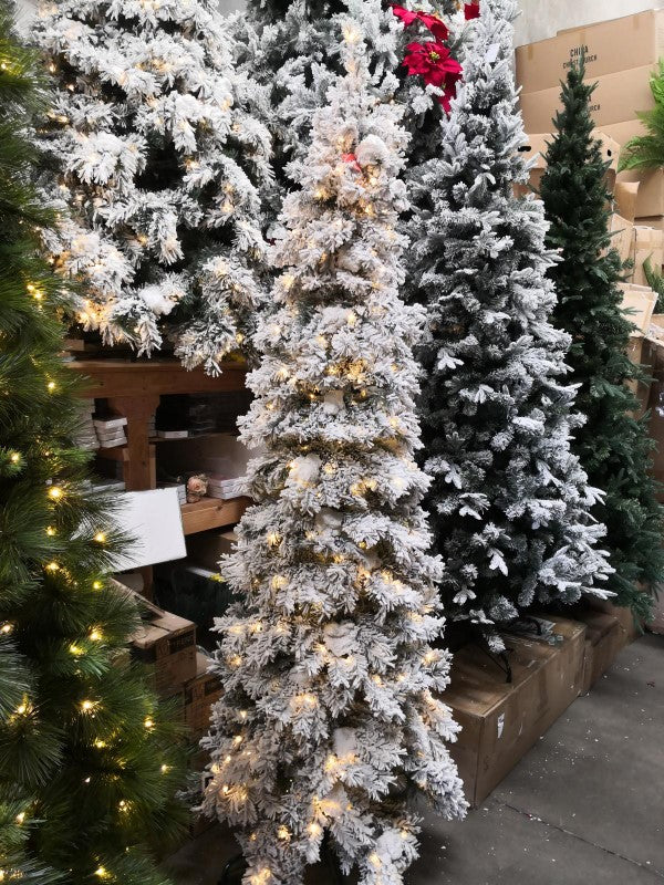 8' heavy snow slim pine tree with 600 warm white LED lights, ideal for festive decor in small spaces.
