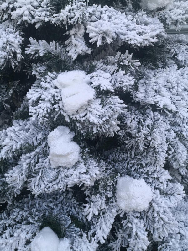 8' Heavy Snow Slim Pine Tree with 600 warm white LED lights and 712 realistic tips, perfect for cozy holiday decor.