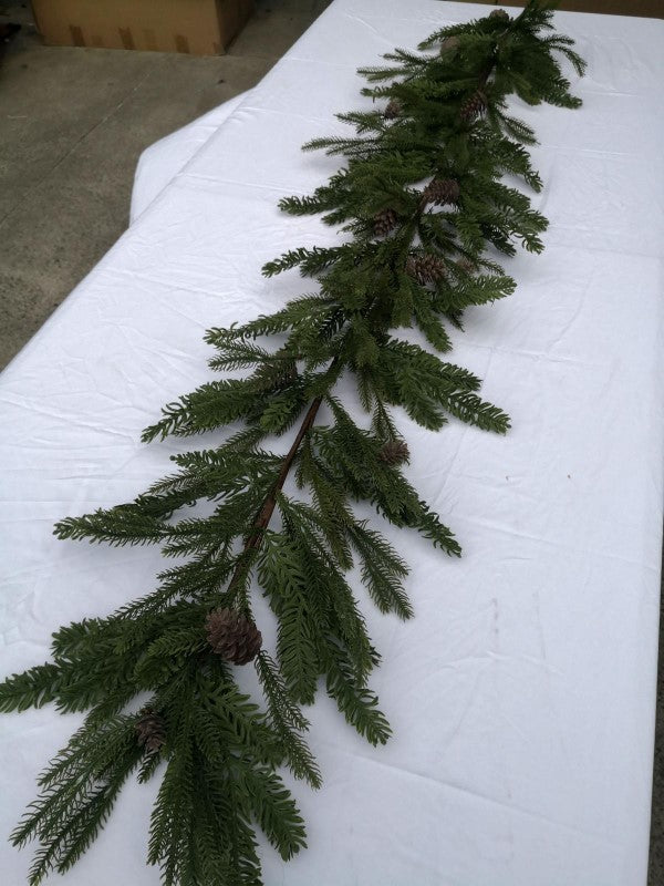 Lush 180cm artificial mixed pine garland with realistic texture and pinecones, perfect for festive decorating.