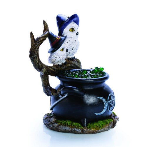 Cauldron-shaped LED light with two white owls and glimmering green bubbles, enhancing mystical home decor.
