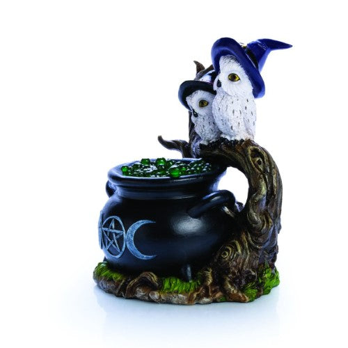 Cauldron-shaped LED light with snowy owls, glowing bubbles, and mystical details; ideal for enchanting decor.