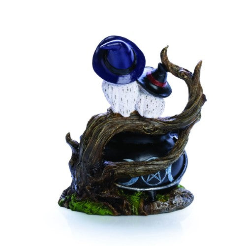 Cauldron-shaped LED lamp featuring two white owls, green resin bubbles, and mystical details, perfect for enchanting decor.