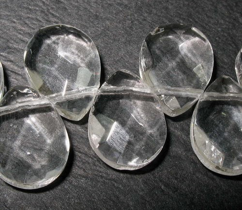 Teardrop-shaped glass beads in vibrant colors, perfect for jewelry making and crafts, 9x12mm, 47 pieces.