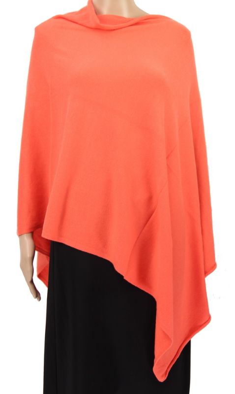 Lightweight apricot stretch poncho, perfect for layering and versatile styling for any occasion.
