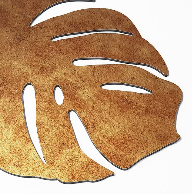 Antique gold textured wall art featuring three intricately designed monstera leaves, perfect for modern and bohemian decor.