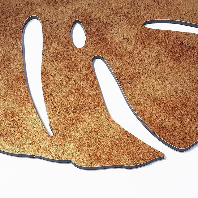 Antique gold textured wall art set featuring three monstera leaves, perfect for modern and bohemian decor styles.