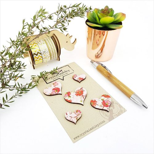 Heart-shaped pink floral wall art set featuring five durable MDF pieces, ideal for adding elegance to any room.