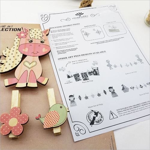 Colorful pony-shaped pegs for hanging kids' art and photos; made from eco-friendly pine veneer, perfect for creative decor.