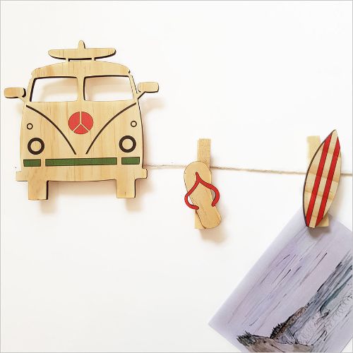 Surfer van art pegs designed for hanging photos and notes, adding coastal charm to any room.