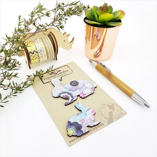 Adorable bunny wall art with vibrant blue florals, perfect for nursery decor and playful spaces.