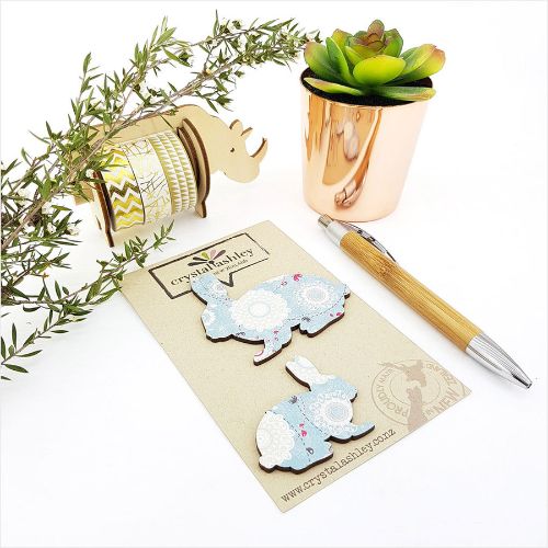 Whimsical blue bunny wall art in mini shapes, perfect for nurseries and adding playful charm to any room.