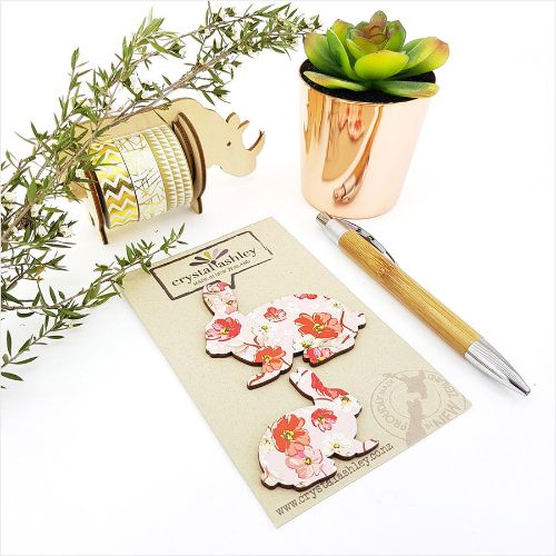 Whimsical wall art featuring cute bunnies and pink florals, perfect for nurseries and playful decor.