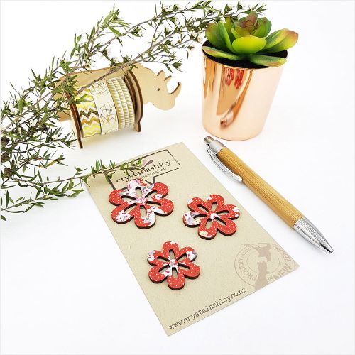 Vibrant red floral mini shapes wall art featuring daisies, crafted from durable MDF for a lively home decor accent.
