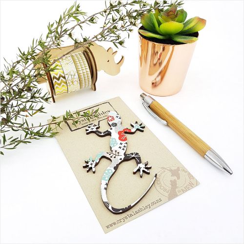 Colorful wall art featuring whimsical mini gecko shapes, perfect for enhancing any living space with charm and creativity.