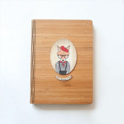 Eco-friendly bamboo journal featuring a printed girl fox design, perfect for journaling, sketching, and travel notes.