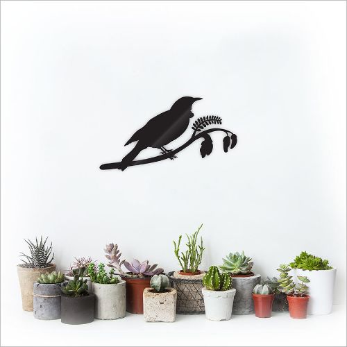 Kiwiana wall art of a tui perched on vibrant kowhai blossoms, handcrafted from durable Aluminium Composite Material.
