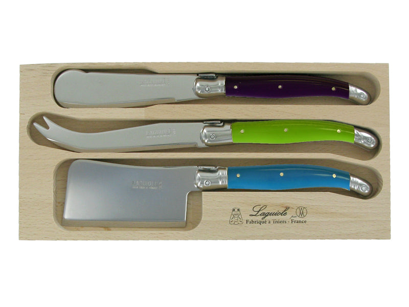 Stunning cheese set with blue, green, and purple handles; includes knife and cleaver, perfect for elegant dining.