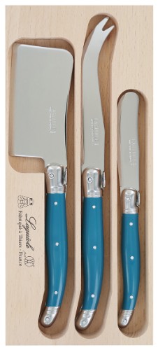 Verdier Cheese Set in Teal featuring a stainless steel spreader with vibrant resin handles and Laguiole Bee emblem, presented in a wooden tray.