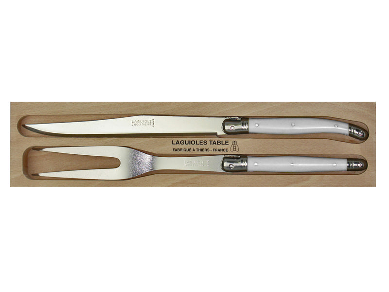 Elegant white carving set by Andre Verdier featuring stainless steel knives and forks with durable resin handles, made in France.