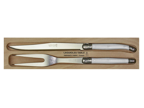 Elegant white carving set by Andre Verdier featuring stainless steel knives and forks with durable resin handles, made in France.