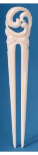 Heru comb featuring a small triple Koru design, symbolizing new beginnings; handcrafted and unique in color variations.