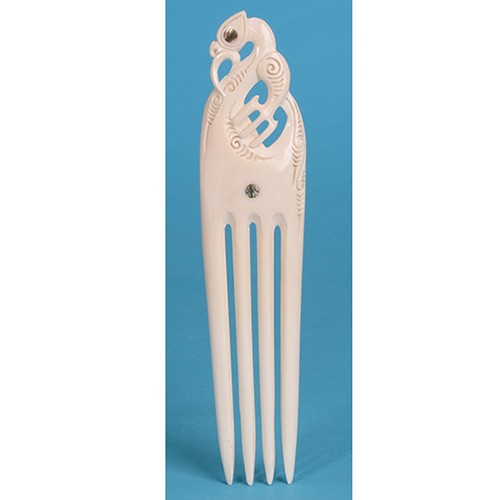 Extra large bone comb featuring Manaia symbol and unique paua shell inlays, representing New Zealand craftsmanship and protection.