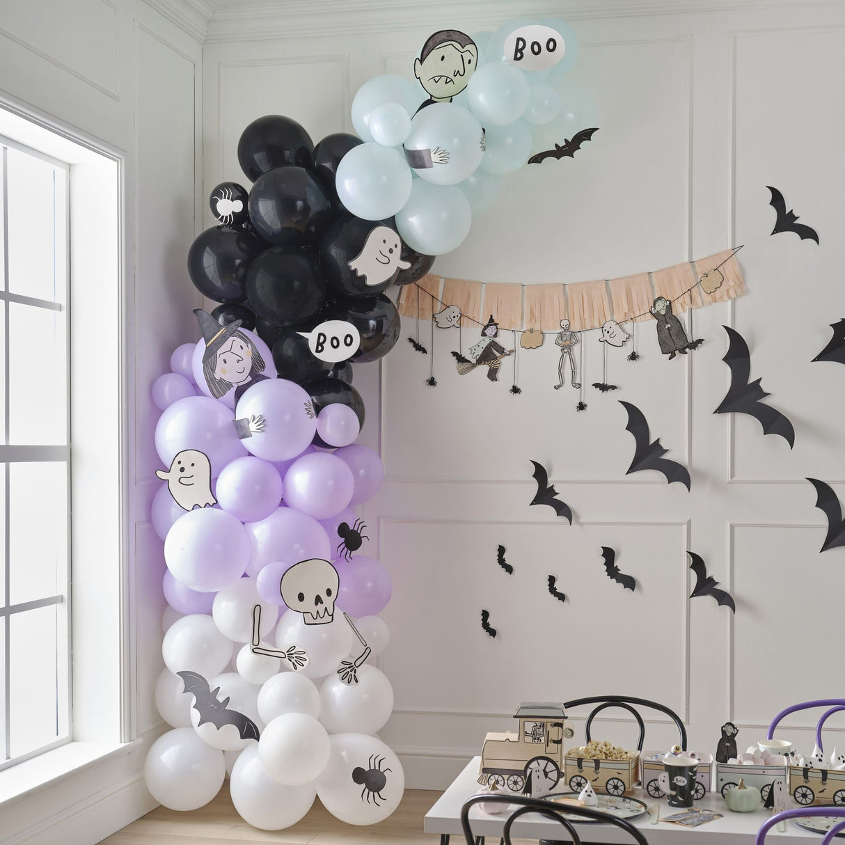 Colorful Halloween balloon arch kit featuring 95 assorted spooky balloons and fun characters for festive decorations.
