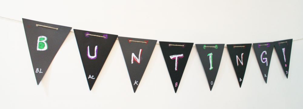 Reusable chalkboard bunting for customizable wall art, perfect for events and everyday decor, made from durable polypropylene.