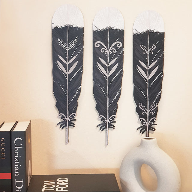 ACM Wall art featuring three beautifully printed Kiwiana Huia feathers, perfect for decorating indoor or outdoor spaces.