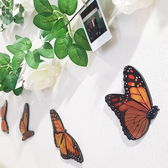 Vibrant Kiwiana Monarch butterfly wall art set, featuring five unique designs on durable ACM for indoor/outdoor decor.