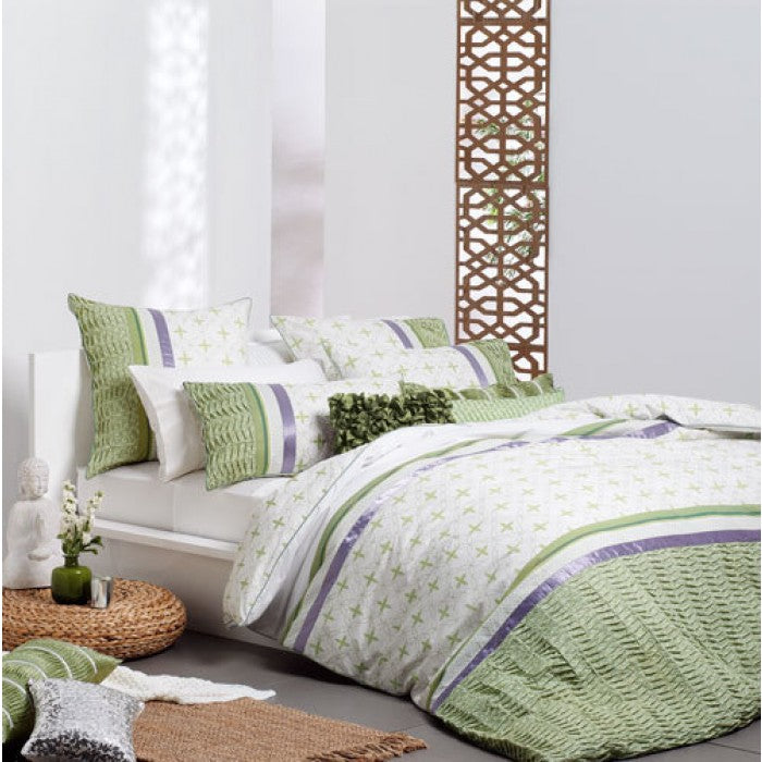 Duvet cover set featuring modern fern design, pintuck details, and ribbon trim, perfect for a serene bedroom retreat.