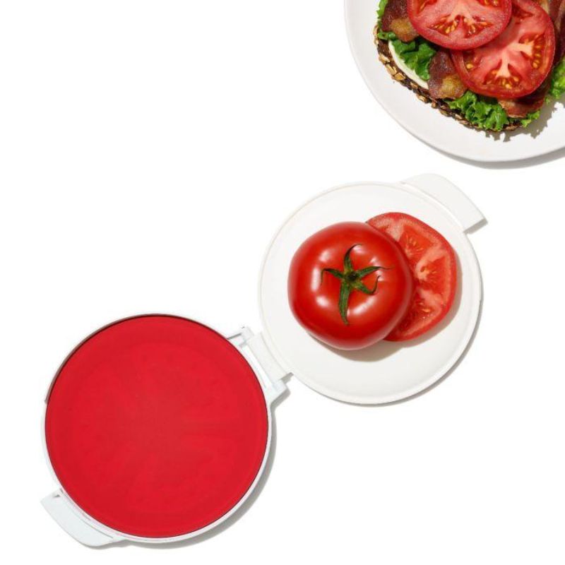 OXO Good Grips Cut & Keep Silicone Tomato Saver, eco-friendly, seals cut tomatoes fresh with hinged lid and flat base design.