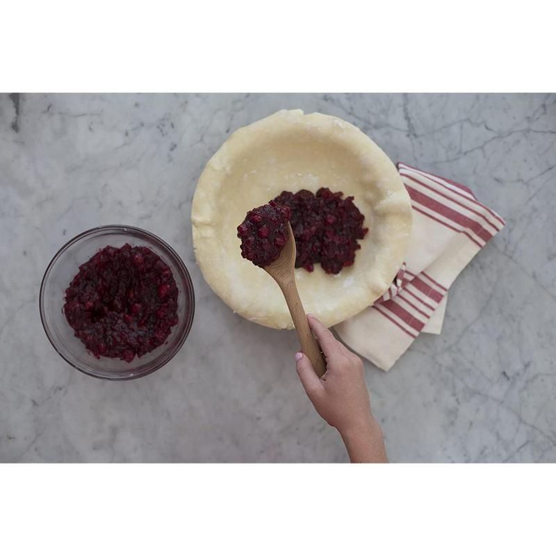 Wooden spoon made of solid beech wood, featuring a comfortable handle and safe for non-stick cookware. Perfect for stirring and mixing.