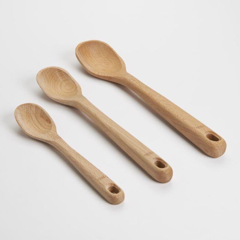 Three-piece OXO Good Grips spoon set in beechwood, features large, medium, and small spoons for versatile cooking tasks.