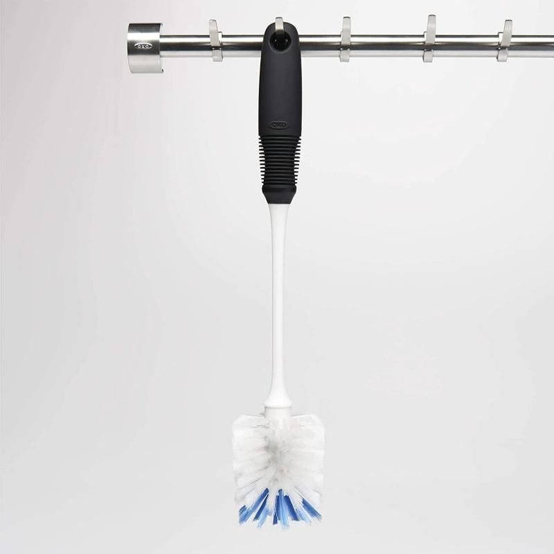 Long-necked OXO Good Grips Bottle Brush with dual bristle head for gentle and tough scrubbing, safe for delicate glassware.