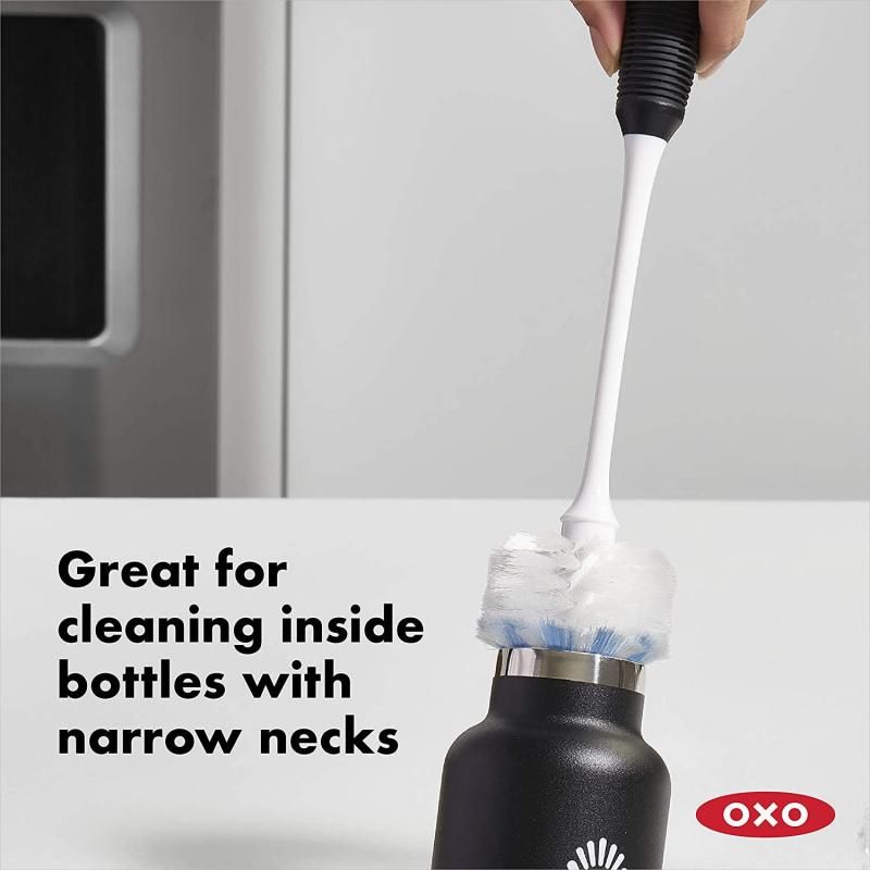Long-necked OXO Good Grips Bottle Brush with dual bristle head for gentle cleaning and scrubbing, ideal for delicate containers.
