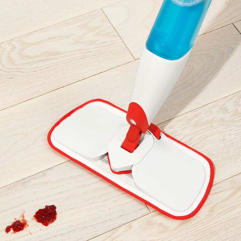 Microfiber refill pad for OXO Spray Mop, designed to trap dirt, dust, and grime; machine washable for eco-friendly cleaning.
