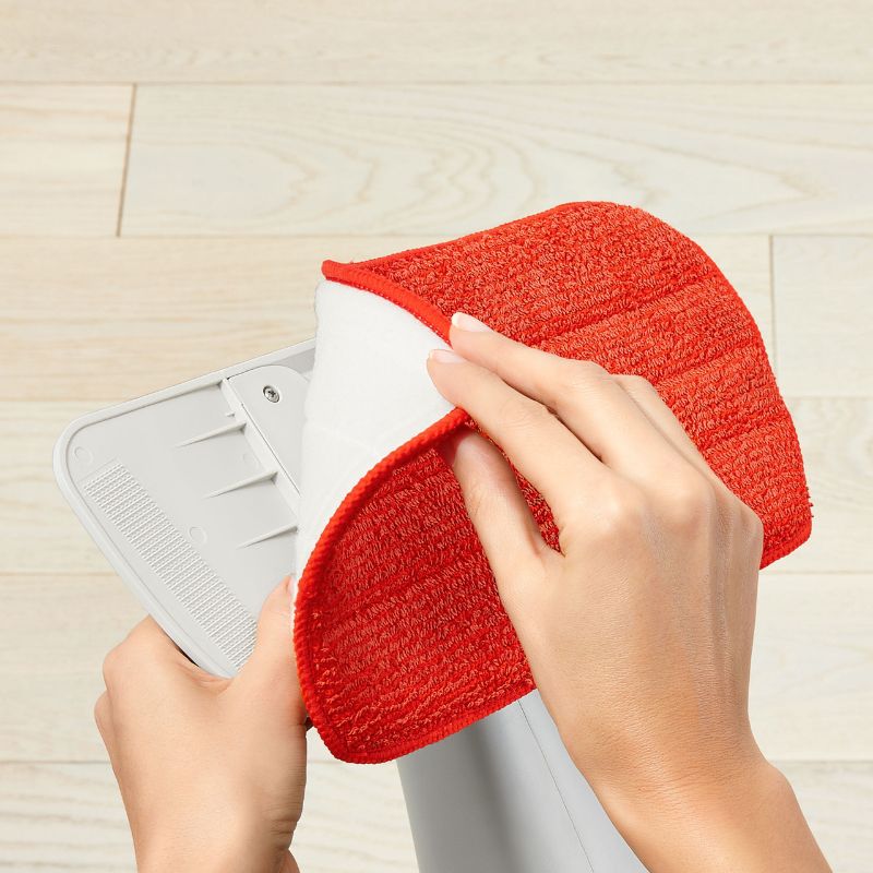 Microfiber refill for OXO Spray Mop, designed for effective cleaning of hardwood, tile, and laminate floors.