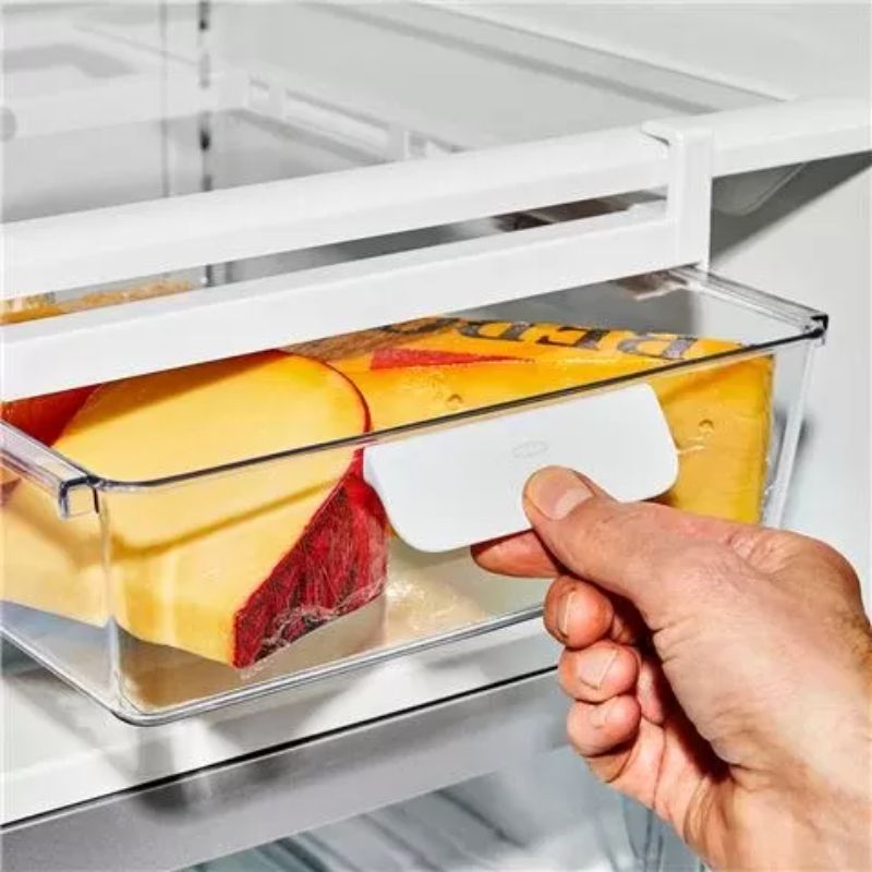 Clear OXO Refrigerator Under-Shelf Drawer for organized storage of deli meats, cheeses, and fruits; tool-free adjustable design.