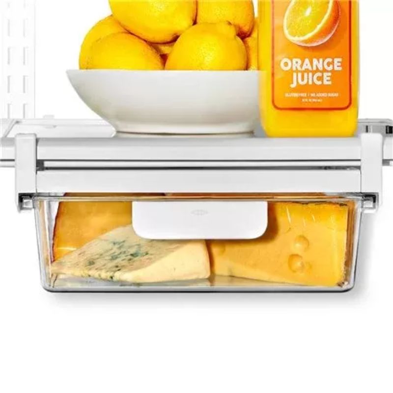 Clear under-shelf drawer for organized fridge storage, 27x38x8cm, with rounded handles and adjustable frame.