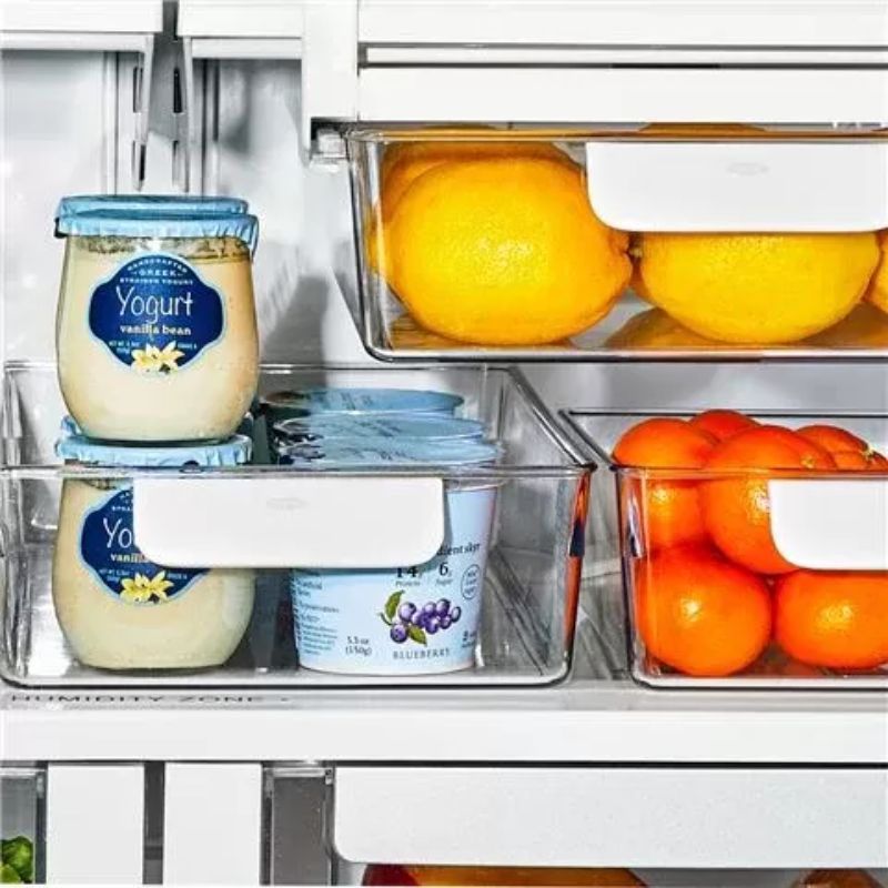 Clear OXO refrigerator storage bins set of 4, featuring durable design, rounded handles, and customizable organization for food.