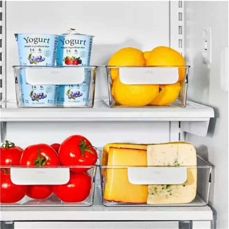 Clear OXO Refrigerator Storage Bin Starter Set of 4, ideal for organizing food with durable, BPA-free design and easy grip handles.