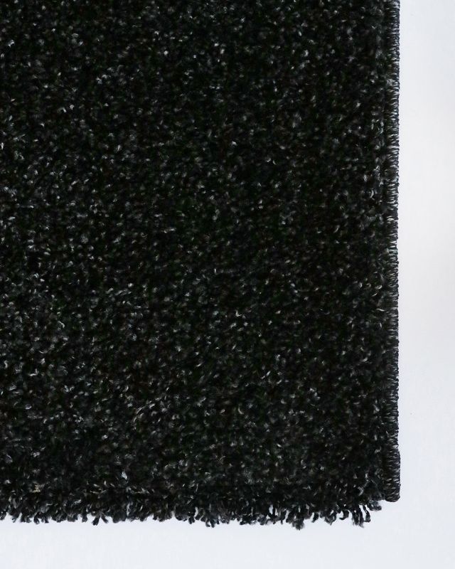 Stylish black fleck rug measuring 200x290cm, featuring a soft shaggy texture for comfort and durability in any living space.