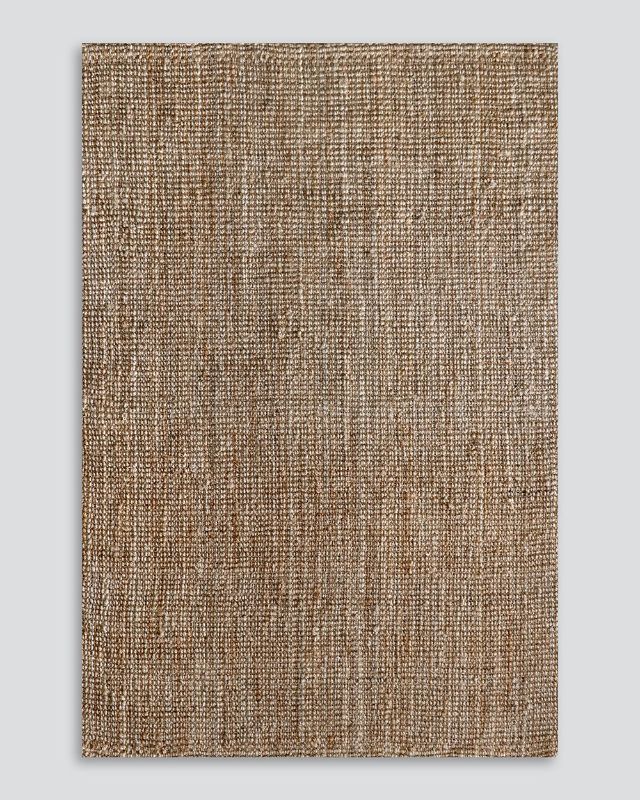 Handwoven 250x350cm natural jute rug, adding eco-friendly elegance and rustic charm to contemporary interiors.