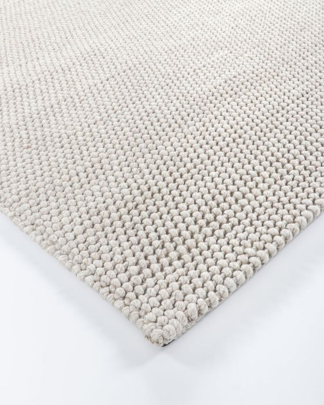 Handwoven Cyrus Floor Rug in earthy tones, 160x230cm, features a textured knot weave for comfort and style in any room.