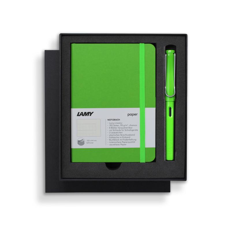 Lamy green fountain pen and soft cover notebook gift set, featuring ergonomic design, polished steel nib, and high-quality paper.