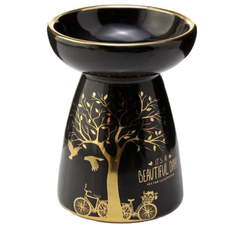 Ceramic oil and wax burners in metallic gold with tree design, perfect for creating a fragrant ambiance in any room.